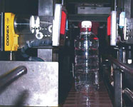 Bottles are inspected by two Cognex 5400 vision sensors: one on each side of the bottle